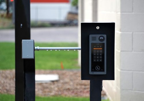 pexels photo 13007854 13007854 Outdoor intercom mounted at a residential building entrance, ensuring security and communication.