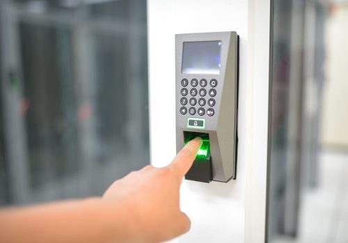pexels photo 17155842 17155842 A person uses a fingerprint scanner for secure entry in a business setting.