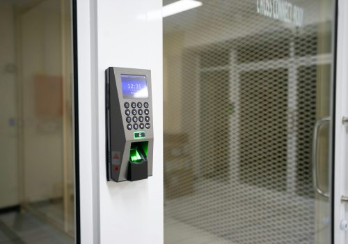 A modern fingerprint scanner for secure access control in an office environment.